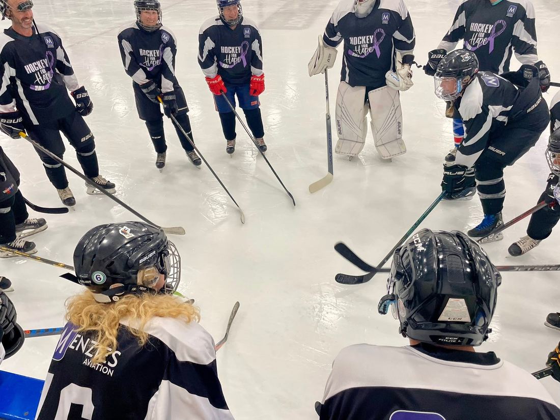 Players skating during a game at the Bedford four-pad arena