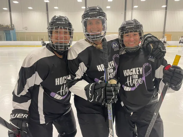 Three players in Hockey for Hope jerseys standing arm in arm on the ice