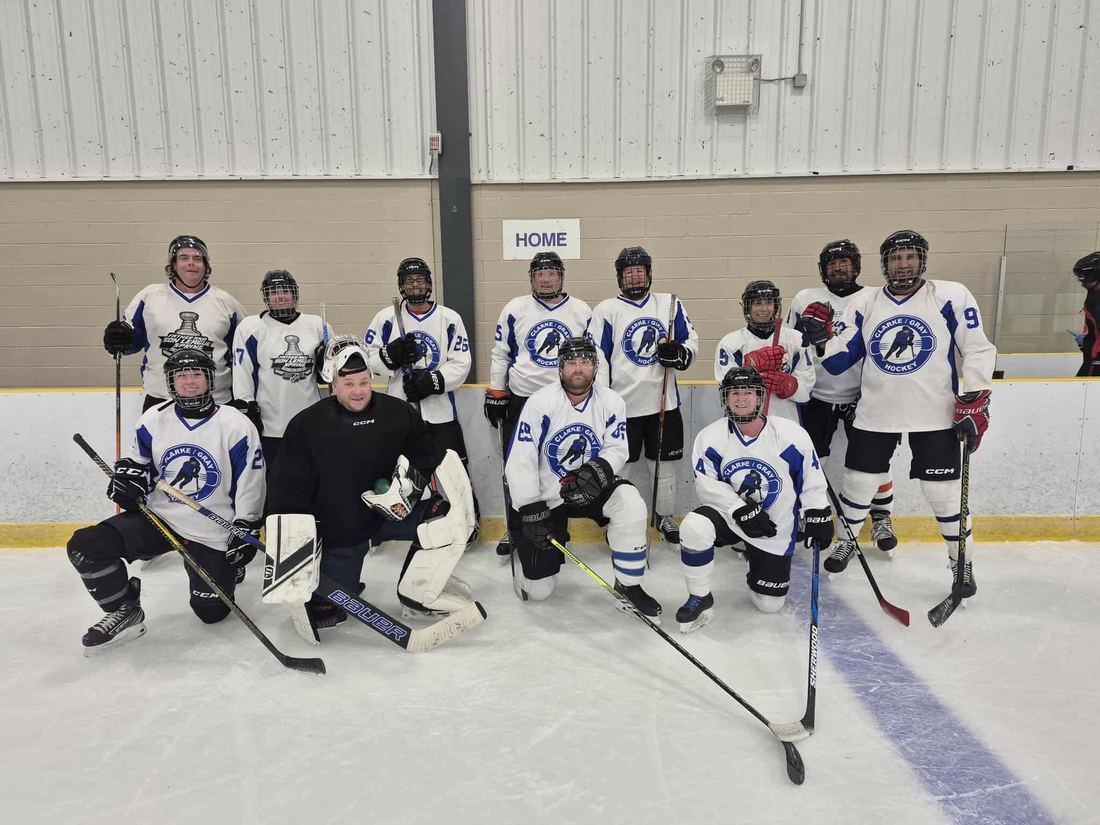A co-ed team gathered on the ice at the Greenfoot Energy Centre in Bedford